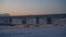 City embankment in winter. Winter cityscape, bridge with cars