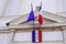 City hall facade france flag in town center on stone building with french text liberte egalite fraternite means freedom equality