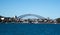 City Harbourside houses at Robinsons Point Birchgrove Sydney Australia with Harbour bridge in background against blue sky