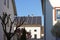 city house rooftops with chimney and antenna and solar panels