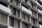 City housing, concrete apartment building with tinted windows