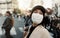 City, japan and woman in travel with face mask for health and walking in town. Covid compliance, safety for wellness and