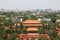 City landscape. Drum tower at the end of the road. On the horizon is the Olympic tower and the building of IBM. View of the northe