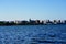 City landscape photo of Madison, Wisconsin capitol and city buildings from Olin park