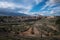 City landscape of the town under a blue sky with a olive field in the foreground, Colmenar de Oreja, Spain