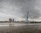 City Landscape - view on Erasmus Bridge on rainy cloudy day, city of Rotterdam