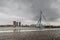 City Landscape - view on Erasmus Bridge on rainy cloudy day, city of Rotterdam