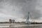 City Landscape - view on Erasmus Bridge on rainy cloudy day, city of Rotterdam