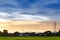 City landscape view sunset over rice field plantation farming with house and telecom