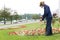 City landscaper cutting grass