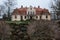 City Liepupe, Latvia. Old yellow manor with garden.Travel photo