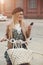 City lifestyle stylish hipster girl with bike using a phone text
