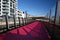 City Lightpath. Urban walkway in pink color for bicycle riders. Nelson Street Cycleway, Auckland, New Zealand