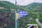 City Meteora, Greek Republic. Mountains and Greek flag. 12. Sep. 2019. Travel photo