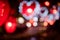 City night light blur bokeh , defocused red heart light background