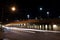 City night traffic coming out of a railroad bridge tunnel viaduct in urban Chicago