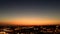 City night from the view point on top of hill at beautiful sunset. Bird view over the city at night with abstract urban night