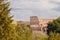 City panorama Rome, Italy Colosseum or Coliseum ancient ruins background blue sky stone arches and sunset