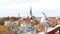 City panorama Tallinn old town view from balcony on front seagull bird medieval house red ruffles travel to Estonia Europe