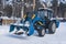 City Park, Balashikha, Russia - February 19, 2021. Mechanized cleaning of fallen snow with the help of harvesting equipment.