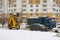 City Park, Balashikha, Russia - February 19, 2021. Mechanized cleaning of fallen snow with the help of harvesting equipment.