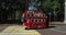 In the city park of Sokolniki a pleasure bus rides and parents walk with children