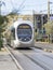 City passenger tram rides on rails