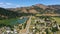 City of Powers in Oregon, aerial showing highway and pond.