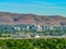 City  of Reno Nevada cityscape with hotels and casinos and mountains in the background.