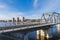 City, Riga, Latvia. River with train bridge with iron construction.