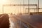 City ring road at sunset with silhouettes of driving cars