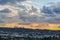 City scape and downtown city towers with panaramic sunset clouds