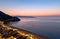 The city of Scilla Calabria Italy. Elevated view of the Marina Grande beach at sunset and the Strait of Messina