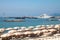 City sea beach with a view of the pier. White ship