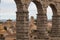 City of Segovia in Spain seen through the arches of the aqueduct monument emblematic of that town