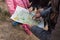 City Sigulda, Latvia. Tourists explore the map during the hike