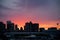 City skyline, with an areoplane at sunset, with a colourful view