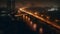 City Skyline at Dusk: Illuminated Evening Reflections on Bridge and Buildings