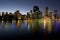 City skyline at dusk by river