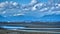 City skyline, snowy mountains and low tide on Boundary Bay.