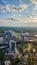 the city skyline at sunset with Mercedes-Benz Stadium, the SkyView Atlanta Ferris wheel, office buildings, hotels and apartments