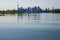 City skyscraper view cityscape background skyline silhouette, lake water and forest with copy space