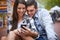 City, smile and couple with a smartphone internet and social media with texting, message and meme. New York, man or