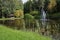 City Smiltene, Latvia.Fountain in the lake and around tree