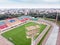 city sports stadium. football field and grandstands with colorful seats