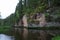 City Straupe, Latvian Republic. Red rocks and river Brasla. Green and overgrown forest. Jun 1. 2019 Travel photo