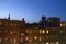 City street apartments skyline against sunset backdrop