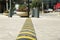 City street with striped plastic speed bump