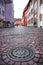 City street view with beautiful carved manhole, Freiburg im Breisgau, Germany