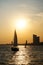 City sunset sailboat